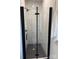 A full shot of the modern shower with mosaic tile, sleek glass, and matte black hardware at 150 Driftwood Dr, Mooresville, NC 28117