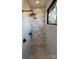 Walk-in shower room featuring a full wall tile accent, slate floor and rainfall shower head at 150 Driftwood Dr, Mooresville, NC 28117