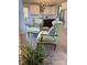 Cozy sitting area with stylish chairs adjacent to the kitchen with white cabinets at 150 Driftwood Dr, Mooresville, NC 28117