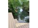 Scenic canal view with multiple boat docks and wooden stairway at 150 Driftwood Dr, Mooresville, NC 28117