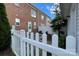 Fenced yard with a back door and brick exterior, offering a private and serene outdoor space at 156 Singleton Rd, Mooresville, NC 28117