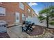 Brick patio with seating area, fire pit, and grill at 156 Singleton Rd, Mooresville, NC 28117