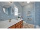 Bathroom with blue dog wallpaper and a bathtub at 156 Singleton Rd, Mooresville, NC 28117