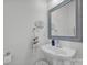 Small bathroom with pedestal sink and framed mirror at 156 Singleton Rd, Mooresville, NC 28117