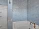 Bathroom with blue dog wallpaper and a walk-in shower at 156 Singleton Rd, Mooresville, NC 28117