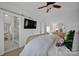 Main bedroom with en-suite bathroom and large TV at 156 Singleton Rd, Mooresville, NC 28117