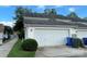 A two-car garage featuring a white garage door, adjacent to a neatly trimmed lawn at 156 Singleton Rd, Mooresville, NC 28117
