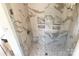 Walk-in shower with marble tile and built-in shelves at 156 Singleton Rd, Mooresville, NC 28117