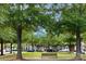 A park featuring well-manicured green space, mature shade trees, and residences at 156 Singleton Rd, Mooresville, NC 28117