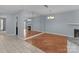 The dining room features a large mirror and hardwood floors that seamlessly connect to living spaces at 17931 Kings Point Dr # G, Cornelius, NC 28031