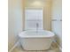 Elegant bathroom featuring a freestanding bathtub and window at 1903 46Th Avenue Ne Dr, Hickory, NC 28601