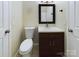 Modern bathroom with dark vanity and toilet at 1903 46Th Avenue Ne Dr, Hickory, NC 28601