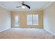 Spacious bedroom with carpet, door, and window at 1903 46Th Avenue Ne Dr, Hickory, NC 28601
