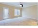 Spacious bedroom with carpet, door, and window at 1903 46Th Avenue Ne Dr, Hickory, NC 28601