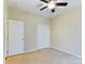 Well-lit bedroom with ceiling fan and double closets at 1903 46Th Avenue Ne Dr, Hickory, NC 28601