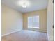 Simple bedroom with neutral walls and carpet flooring at 1903 46Th Avenue Ne Dr, Hickory, NC 28601