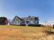 Gray house with a white front porch sits on a grassy lot at 1903 46Th Avenue Ne Dr, Hickory, NC 28601