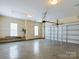Spacious garage with overhead door and storage shelves at 1903 46Th Avenue Ne Dr, Hickory, NC 28601