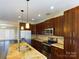 Open concept kitchen with island and stainless steel appliances at 1903 46Th Avenue Ne Dr, Hickory, NC 28601