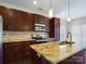 Modern kitchen with granite countertops, stainless steel appliances, and dark wood cabinets at 1903 46Th Avenue Ne Dr, Hickory, NC 28601