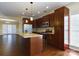 Open concept kitchen with island, hardwood floors, and stainless steel appliances at 1903 46Th Avenue Ne Dr, Hickory, NC 28601