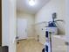 Functional laundry room with shelving and water heater at 1903 46Th Avenue Ne Dr, Hickory, NC 28601