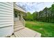 Steps leading to back door with fenced backyard and green space at 2085 Faith Rd, Salisbury, NC 28146