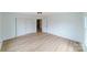 Light-filled bedroom with hardwood floors and double door closet at 2085 Faith Rd, Salisbury, NC 28146