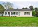 Newly renovated single-story home with gray shutters and a spacious lawn at 2085 Faith Rd, Salisbury, NC 28146
