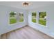 Bright room with hardwood floors and large windows offering street views at 2085 Faith Rd, Salisbury, NC 28146