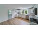 Bright kitchen with white cabinets, granite countertops, and a charming light green door at 2085 Faith Rd, Salisbury, NC 28146