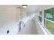 Screened porch with built-in shelving and backyard access at 2085 Faith Rd, Salisbury, NC 28146