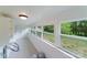 Bright screened porch with built-in shelving and yard views at 2085 Faith Rd, Salisbury, NC 28146