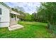 Side yard with stairs leading to the back of the house at 2085 Faith Rd, Salisbury, NC 28146