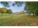 Large backyard with grassy area and autumn leaves at 2500 S Ridge Ave, Kannapolis, NC 28083