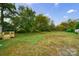 Large backyard with mature trees and grassy area at 2500 S Ridge Ave, Kannapolis, NC 28083