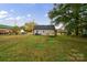 Large backyard with grassy area and a wooden deck at 2500 S Ridge Ave, Kannapolis, NC 28083