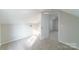 Cozy bedroom with carpet flooring and access to another room at 2500 S Ridge Ave, Kannapolis, NC 28083