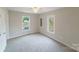 Spacious bedroom with neutral walls and carpet flooring at 2500 S Ridge Ave, Kannapolis, NC 28083