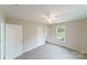 Bright bedroom with neutral walls, carpet flooring, and a ceiling fan at 2500 S Ridge Ave, Kannapolis, NC 28083