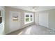Bright bedroom with window seat, carpet, and double doors at 2500 S Ridge Ave, Kannapolis, NC 28083