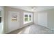 Bright bedroom with window seat, carpet, and double doors at 2500 S Ridge Ave, Kannapolis, NC 28083