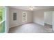 Well-lit bedroom with carpet flooring and neutral walls at 2500 S Ridge Ave, Kannapolis, NC 28083
