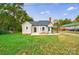 Tan house with gray roof, landscaping, and a spacious yard at 2500 S Ridge Ave, Kannapolis, NC 28083