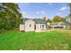 Tan house with gray roof, landscaping, and a spacious yard at 2500 S Ridge Ave, Kannapolis, NC 28083