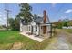 Tan house with gray roof, landscaping, and a spacious yard at 2500 S Ridge Ave, Kannapolis, NC 28083