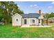 Tan house with gray roof, landscaping, and a spacious yard at 2500 S Ridge Ave, Kannapolis, NC 28083