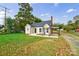 Tan house with gray roof, landscaping, and a spacious yard at 2500 S Ridge Ave, Kannapolis, NC 28083