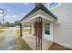 A covered front porch with black metal railings at 2500 S Ridge Ave, Kannapolis, NC 28083