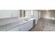 Modern kitchen with white cabinets, granite countertops and stainless steel appliances at 2500 S Ridge Ave, Kannapolis, NC 28083